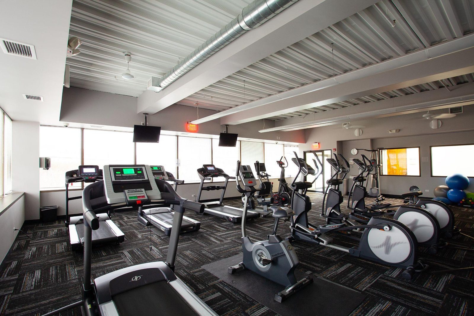 On-site office fitness center at O'Hare Offices in Des Plaines with treadmills and elliptical machines